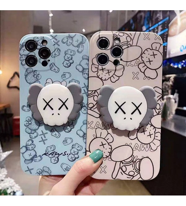 カウズ ブランドiphone13/12pro max/12 mini/12 pro maxケース ハンドバンド付き 韓国風 ホルダー付 KAWS 個性潮 iphone x/xr/xs/xs maxケース 落下防止 ファッション ins風 iphone 11/11 pro/11 pro maxケース かわいい iphone x/8/7 plusケース大人気