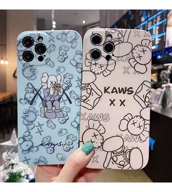 カウズ ブランドiphone13/12pro max/12 mini/12 pro maxケース ハンドバンド付き 韓国風 ホルダー付 KAWS 個性潮 iphone x/xr/xs/xs maxケース 落下防止 ファッション ins風 iphone 11/11 pro/11 pro maxケース かわいい iphone x/8/7 plusケース大人気