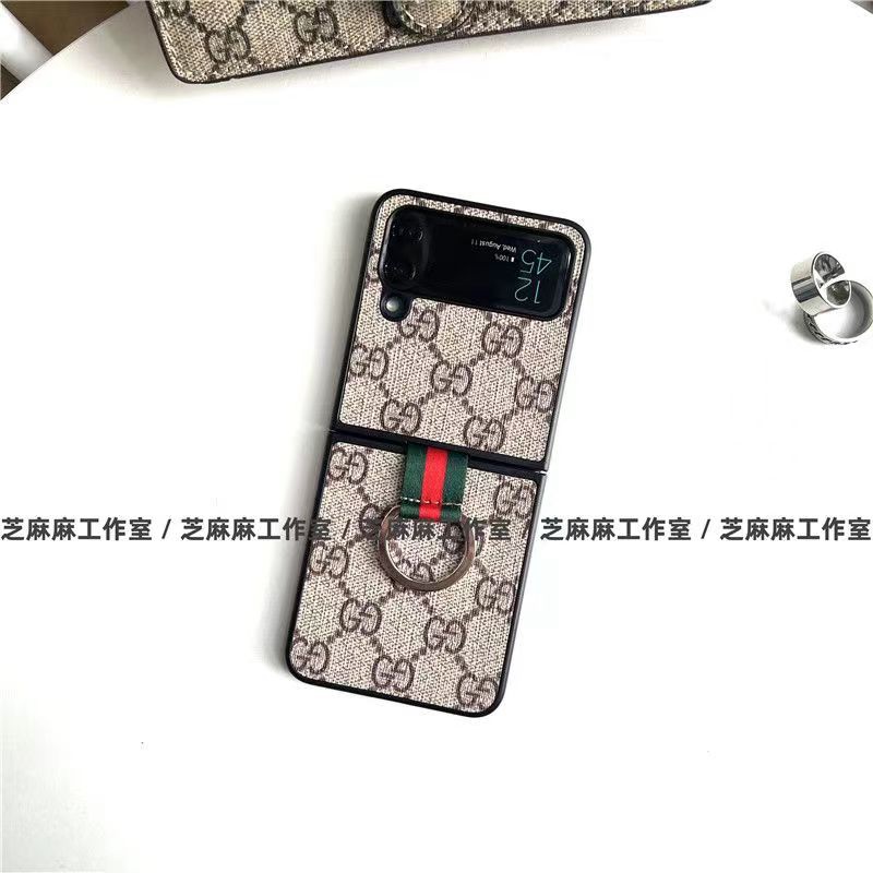 Gucci グッチ ブランド Galaxy z flip 4 5Gスマホケース かわいい モノグラム 折りたたむ式 ストラップ付き 便利 ギャラクシーZ Flip3カバー GG 保護 ファッション セレブ愛用 激安 レディース