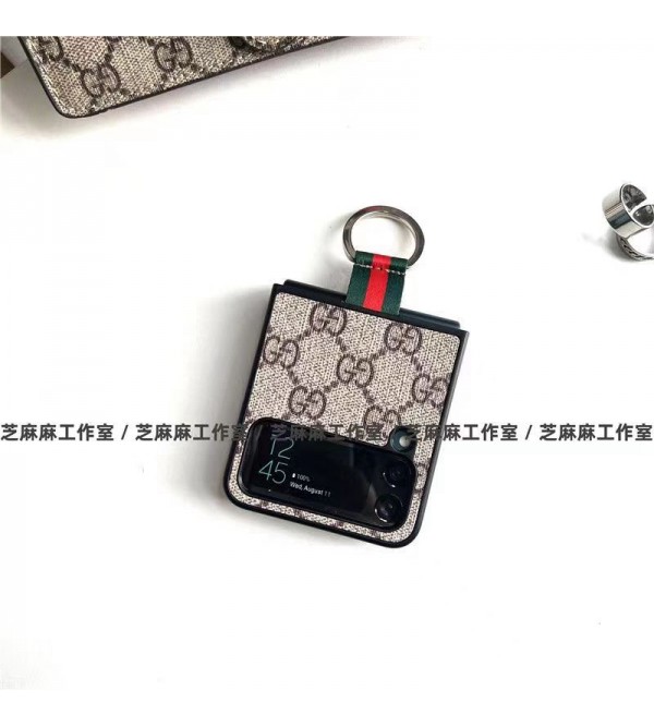 Gucci グッチ ブランド Galaxy z flip 4 5Gスマホケース かわいい モノグラム 折りたたむ式 ストラップ付き 便利 ギャラクシーZ Flip3カバー GG 保護 ファッション セレブ愛用 激安 レディース